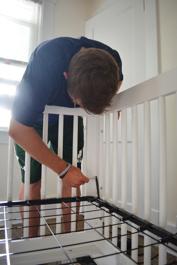 Modern Crib in a Mint & Peach Nursery