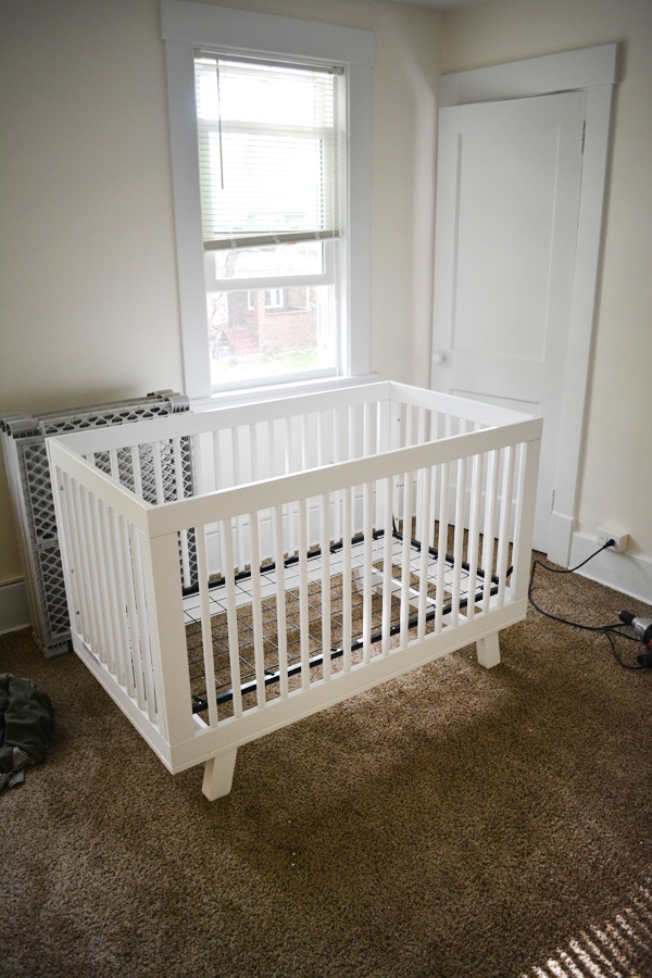 Modern Crib in a Mint & Peach Nursery