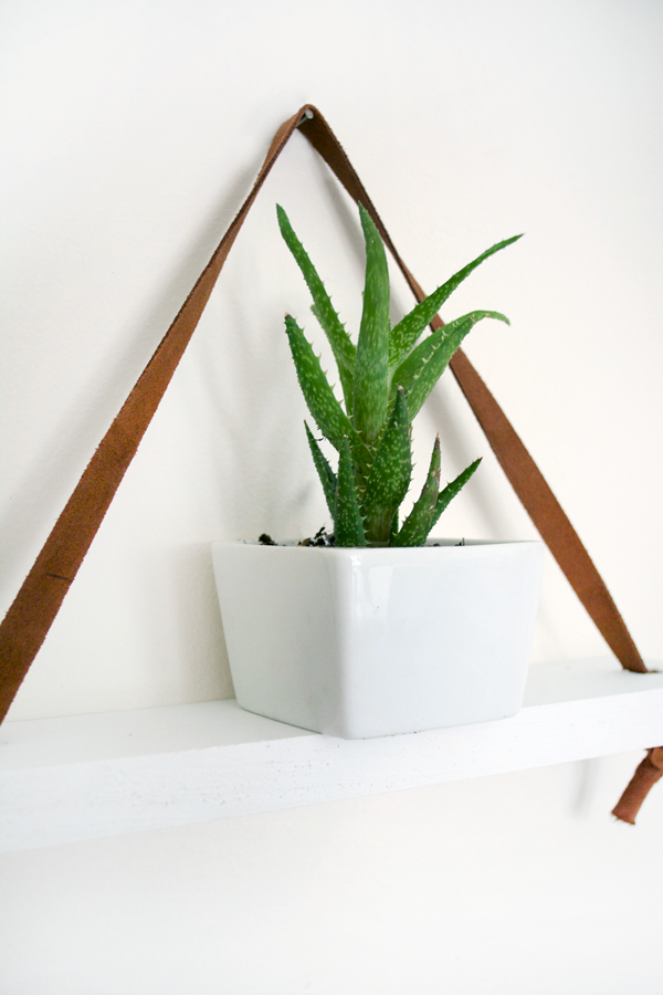 white and leather hanging shelf