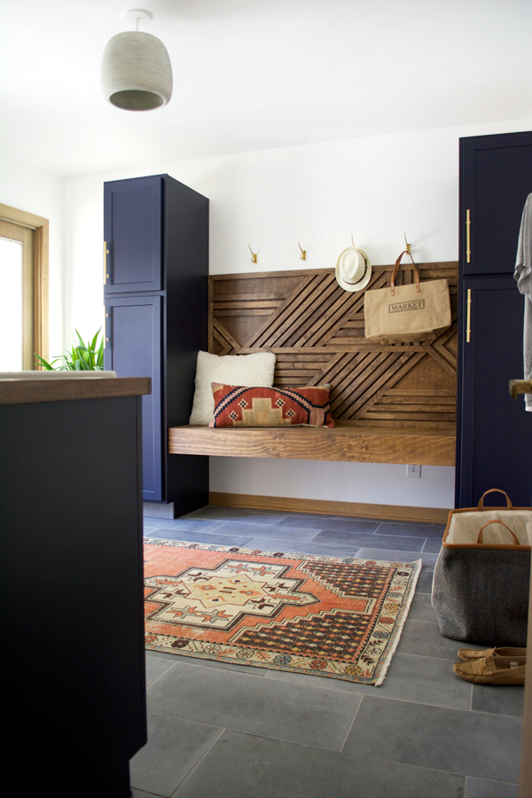A dated space gets a dramatic makeover! Take a look at this Modern Navy Laundry and Mud Room Reveal!