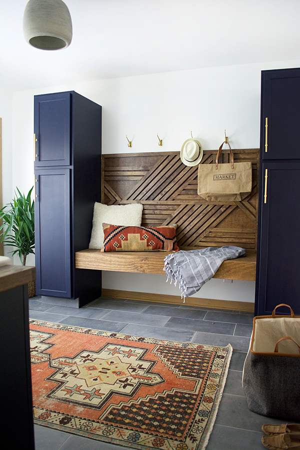 a modern navy laundry and mud room
