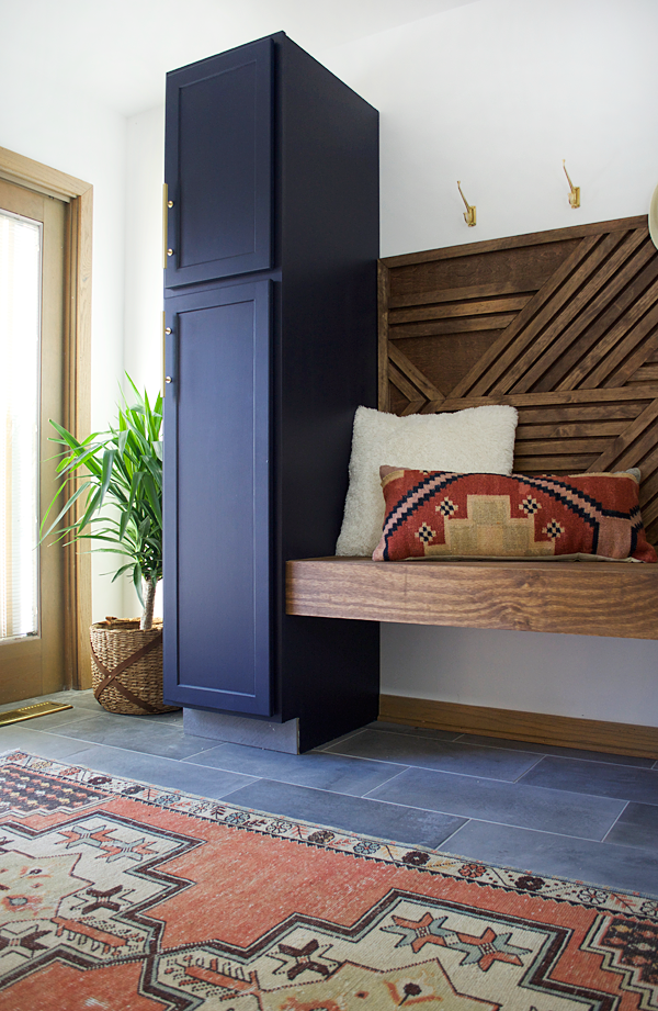 tall navy cabinet in laundry room