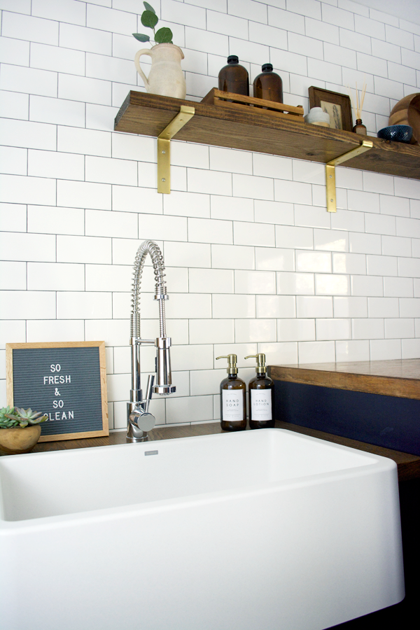 white utility sink in laundry room