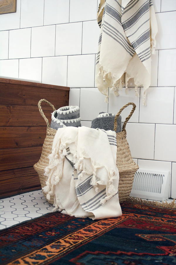 belly basket in the bathroom for towel storage