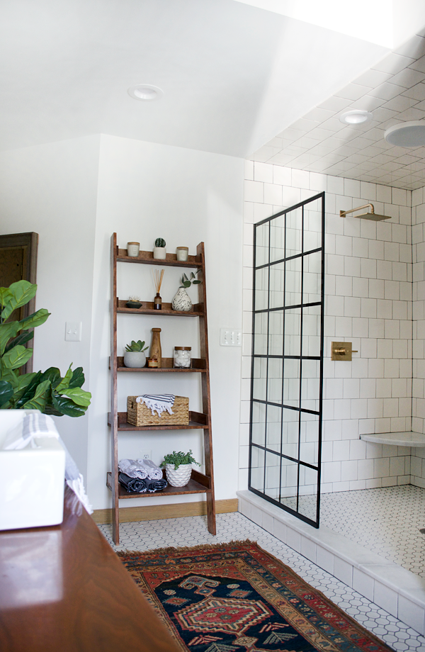 black frame panel door on an open shower in a modern bathroom