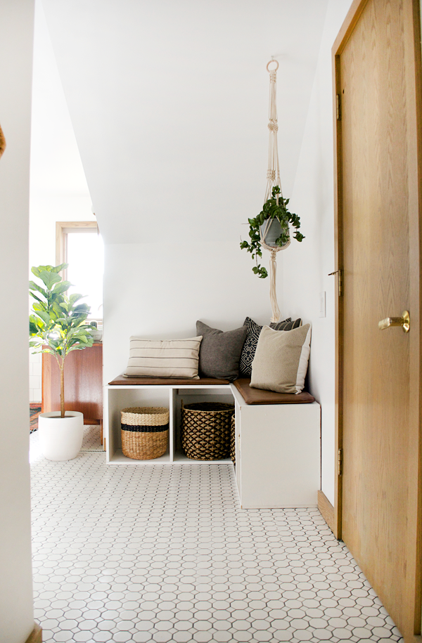 Corner bench with leather seat cushion in bathroom