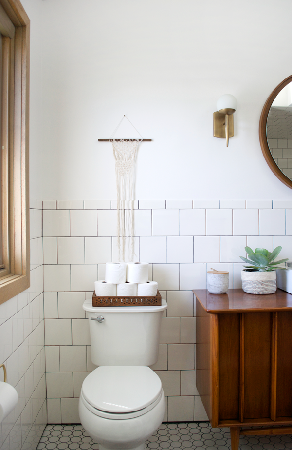 macrame wall hanging above toilet