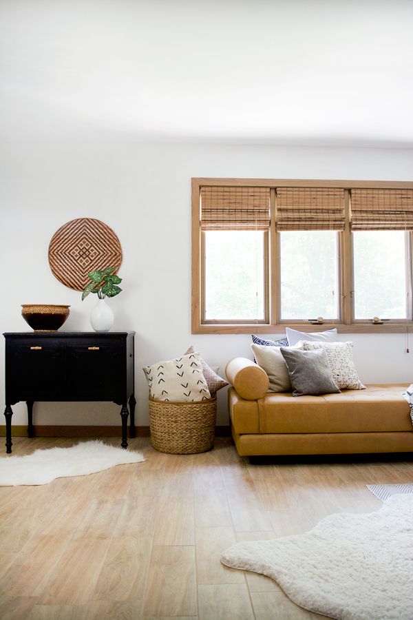 modern boho bedroom with a leather daybed