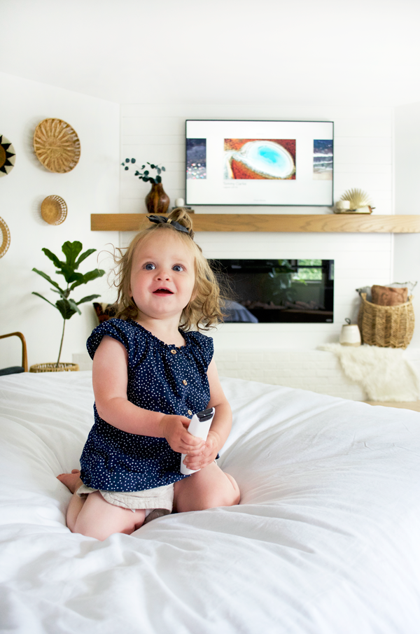 a little girl watching the samsung frame tv