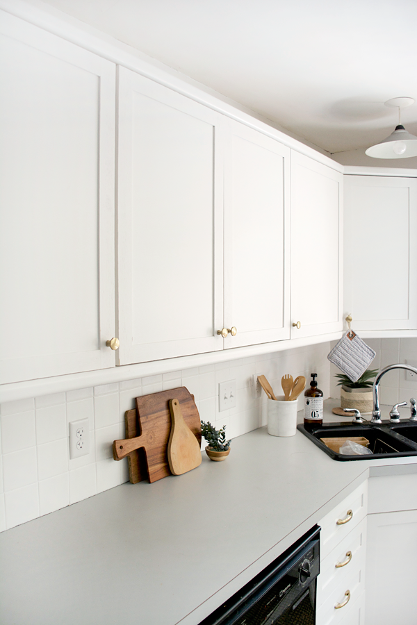 paint and plywood trim transform outdated kitchen cabinets