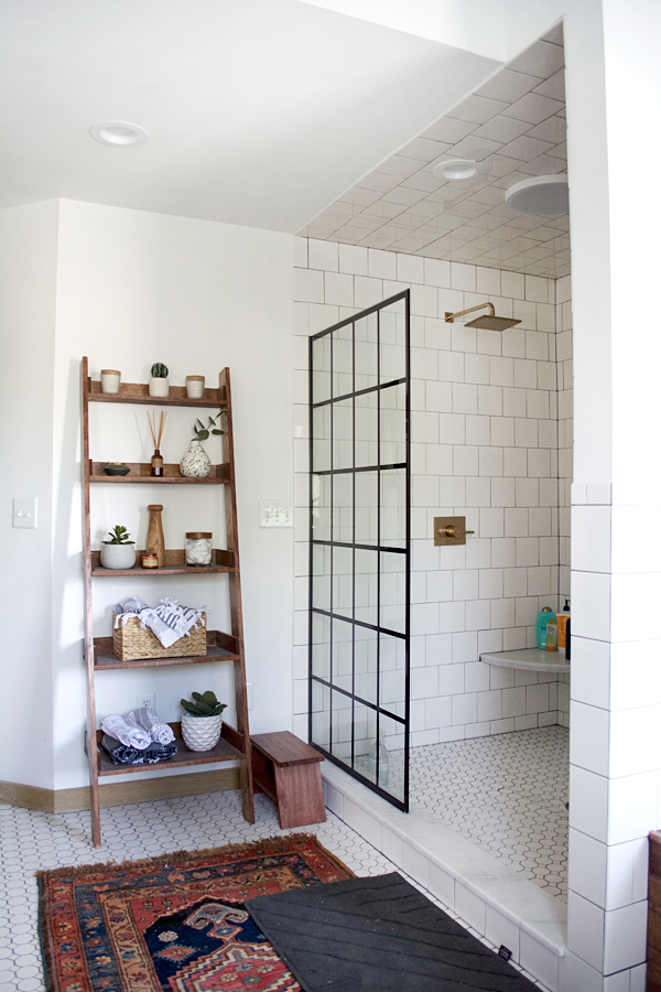 bathroom with vintage rug and leaning shelf