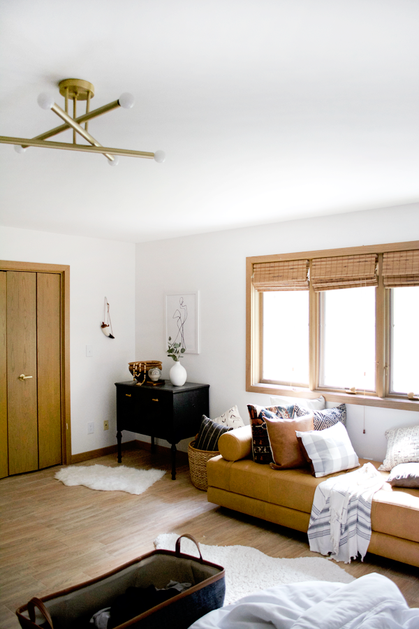 a messy bedroom with wood look tile