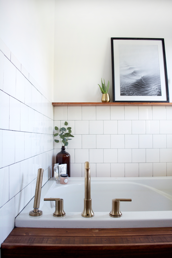 brass tub faucet in a modern vintage bathroom