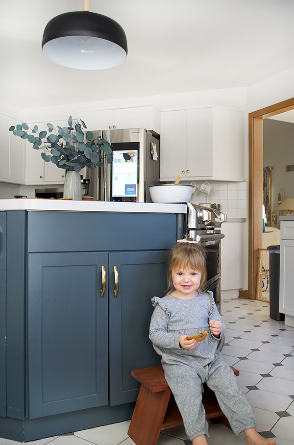 Little girl eating freshly baked cookies