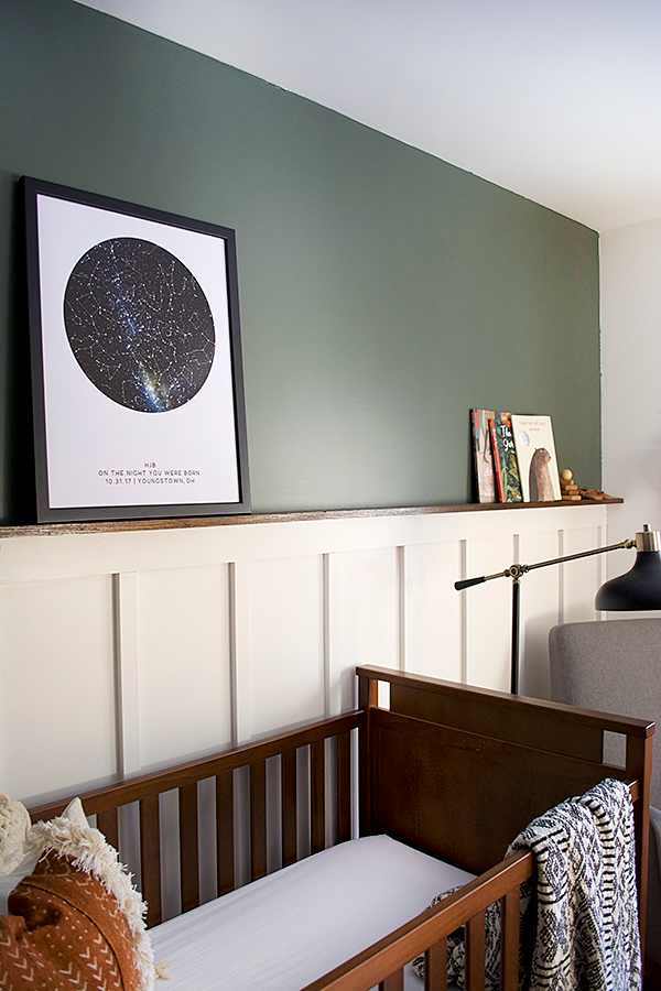 board and batten dark accent wall in nursery