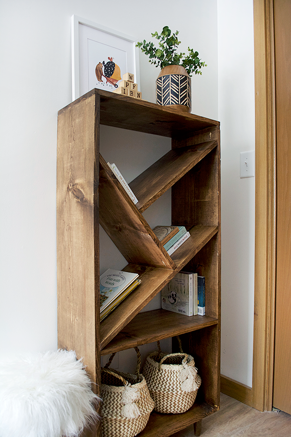 modern angled bookcase in a nursery