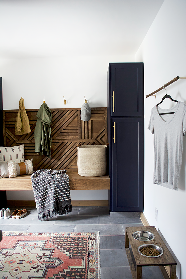 dark cabinets with brass hardware in a mud room