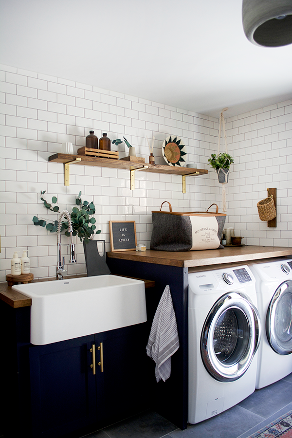 modern navy laundry room with butcher block counter