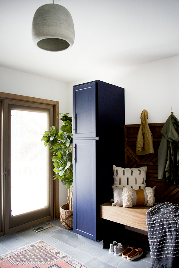 concrete pendant light in mud room