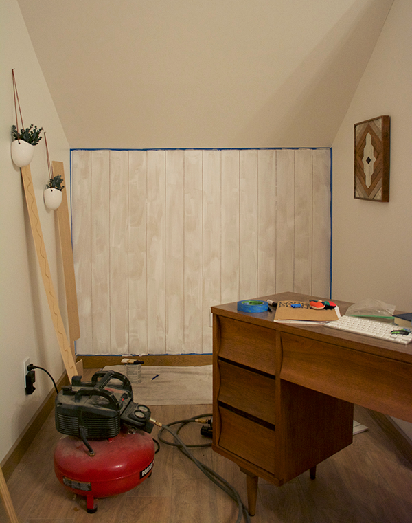 primed shiplap wall before paint