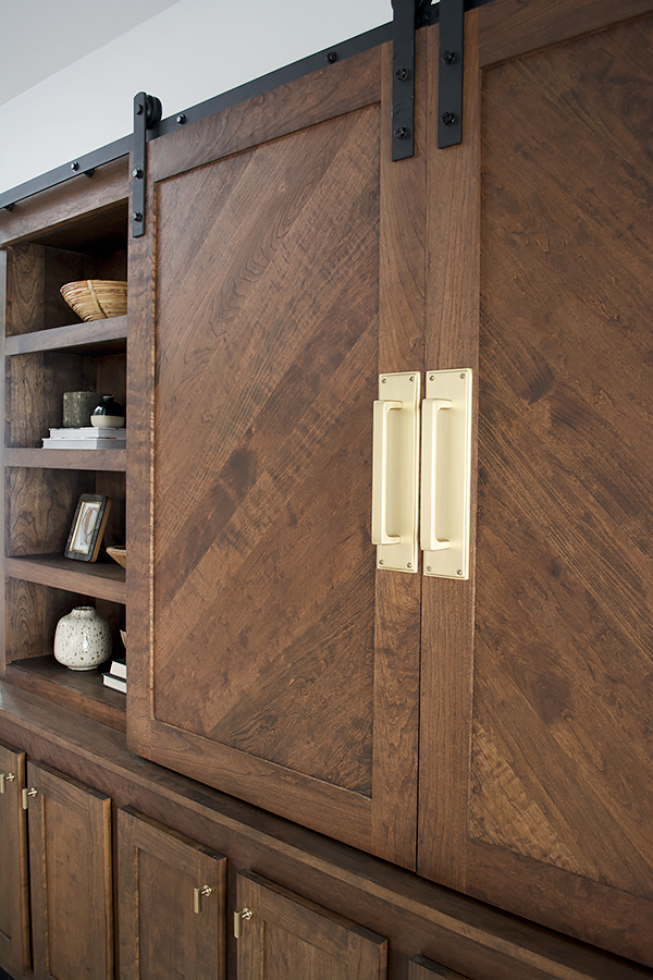 Brass hardware on sliding barn doors