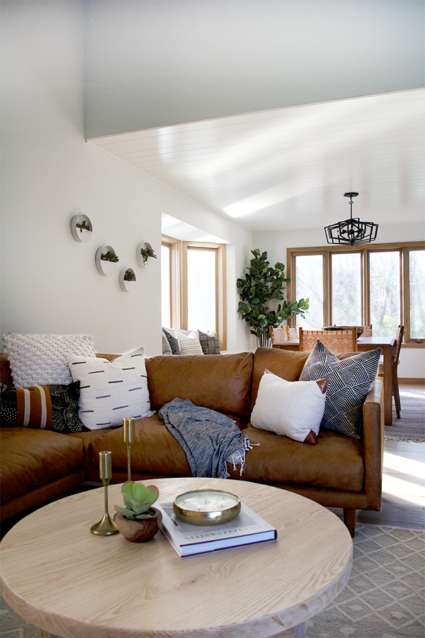 A tan leather sectional in a modern living room