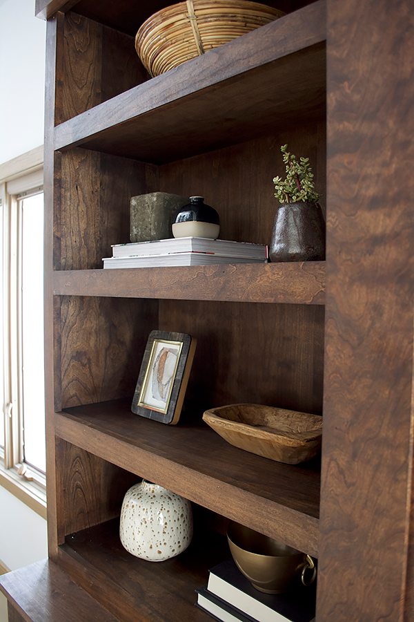 Books and vases used in open shelving