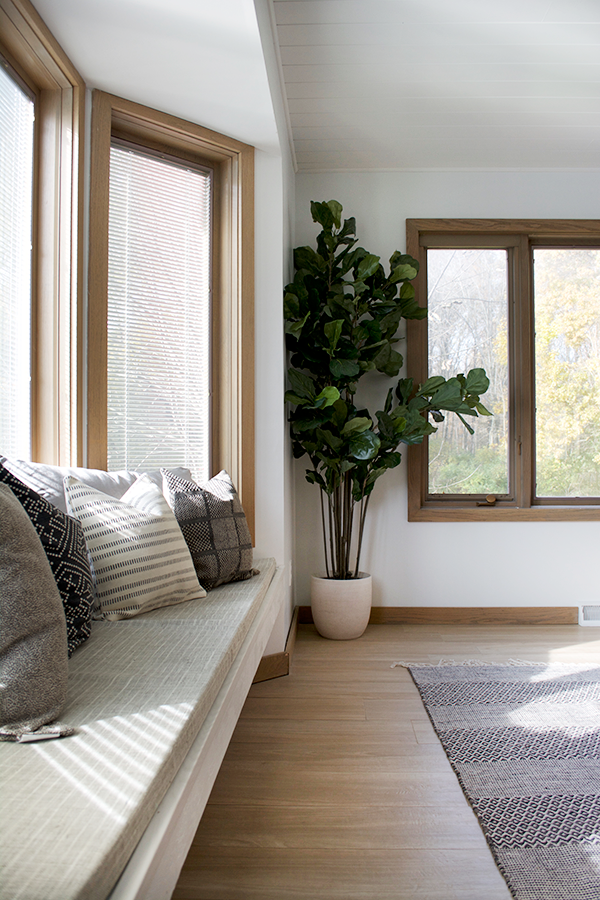 Floating window bench with neutral pillows