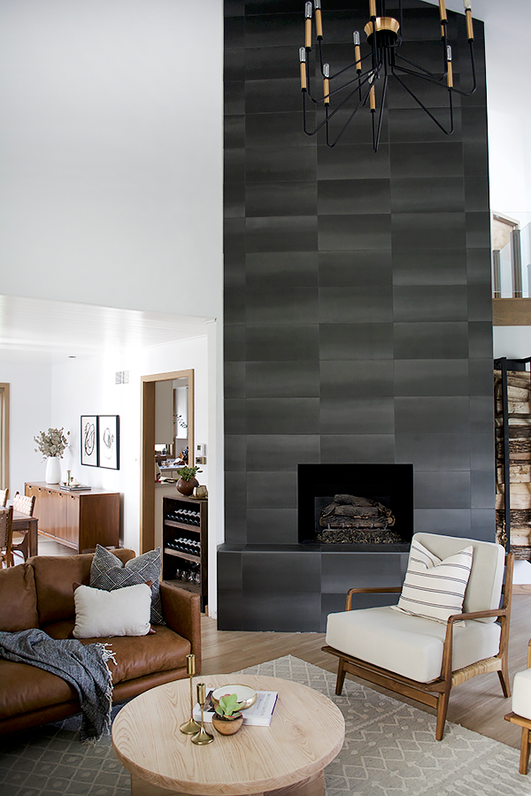 Floor to ceiling fireplace in concrete looking tile