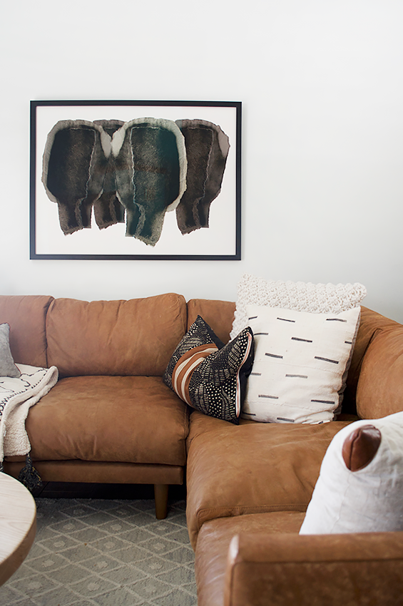 A modern tan leather sectional