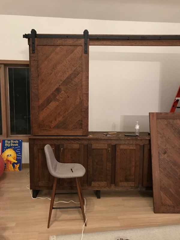 Installing sliding barn door hardware on a tv stand