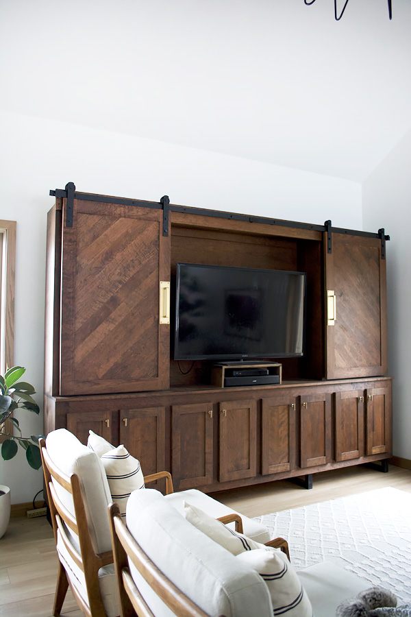 Tv unit with sliding barn doors to hide the television