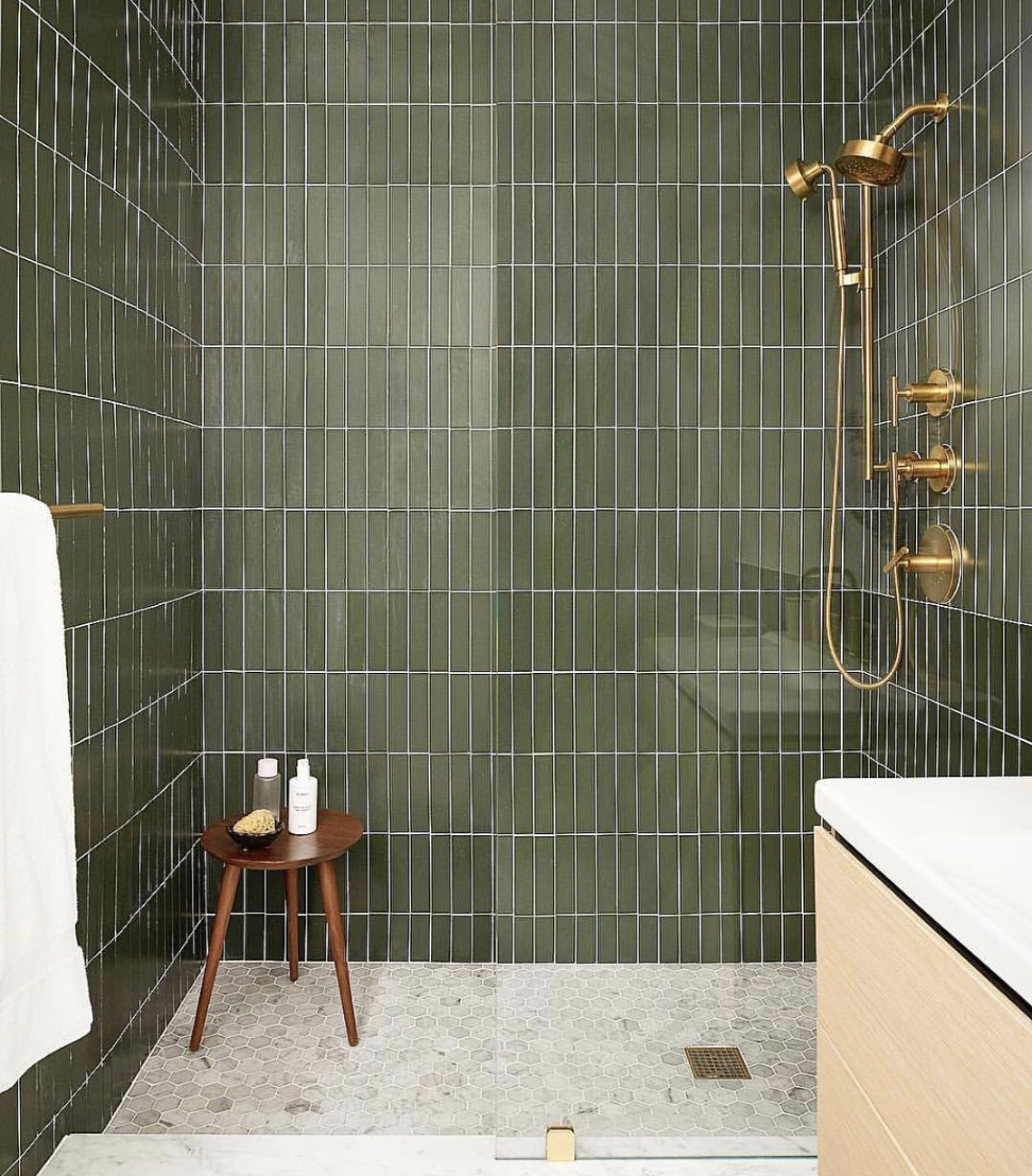 Green tile in bathroom with white grout