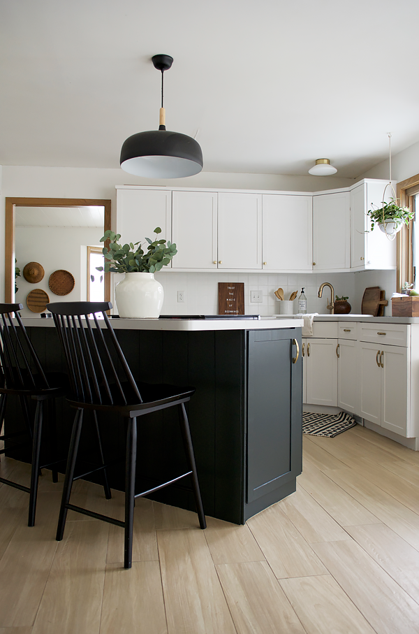 Dark Blue Island Cabinets with Brass Hardware