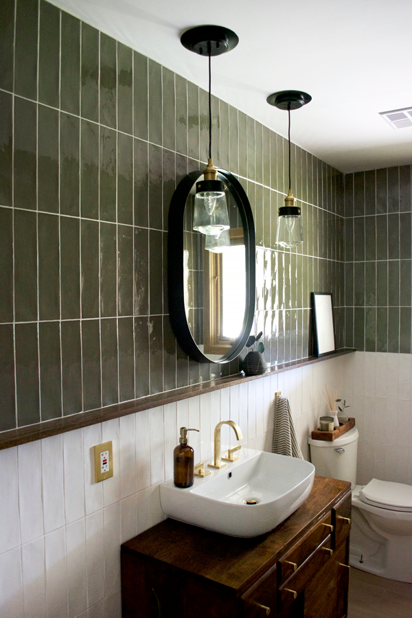 floating wood shelf in bathroom