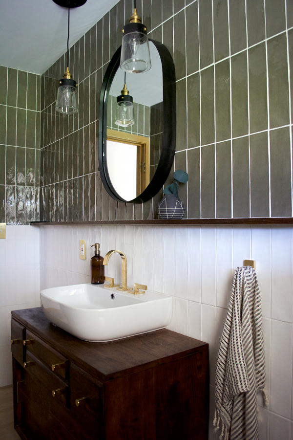 Green vertical stacked tile in a bathroom