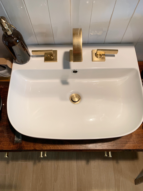 Oval Sink with Brass Faucet