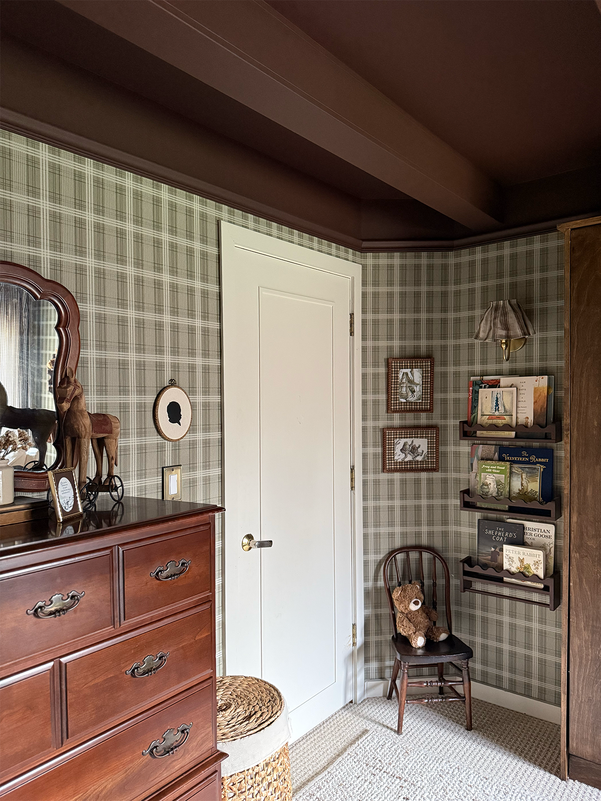 baby boy nursery with vintage decor. book shelf with neutral accents