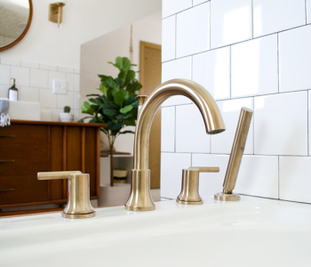 Stylish and Functional Fixtures in a Modern Vintage Bathroom, brass fixtures, brass faucet, champagne bronze