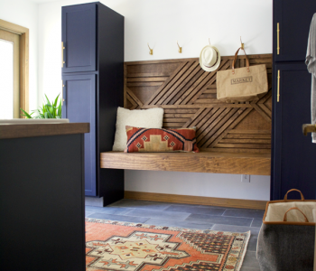 A dated space gets a dramatic makeover! Take a look at this Modern Navy Laundry and Mud Room Reveal!